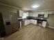 Bright kitchen with stainless steel appliances, white cabinetry, and modern backsplash at 1810 N Parker Ave, Indianapolis, IN 46218