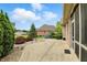 A beautiful backyard featuring a patio, a manicured lawn, and a charming garden with lush greenery at 182 Southwind Ln, Greenwood, IN 46142
