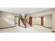 Finished basement with a staircase, neutral walls, and trim, offering plenty of room for customization at 182 Southwind Ln, Greenwood, IN 46142