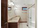 Bathroom with double sinks, granite countertops, and a glass-enclosed shower at 182 Southwind Ln, Greenwood, IN 46142