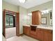 Bathroom with double sinks, custom wood cabinets and direct access to backyard at 182 Southwind Ln, Greenwood, IN 46142
