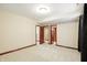 A spacious bedroom with neutral tones showcases multiple doorways leading to other areas of the house at 182 Southwind Ln, Greenwood, IN 46142