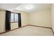 Bright bedroom featuring plush carpeting, neutral walls, and dark accent trim at 182 Southwind Ln, Greenwood, IN 46142