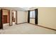 A bedroom featuring soft carpeting with an open door that leads into the bathroom at 182 Southwind Ln, Greenwood, IN 46142