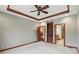 Spacious bedroom with carpet flooring, built-in shelves, and entry door at 182 Southwind Ln, Greenwood, IN 46142