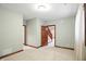 A neutral bedroom features soft carpeting, and a glimpse of stairs is visible through the open doorway at 182 Southwind Ln, Greenwood, IN 46142
