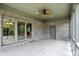 Covered patio with brick walls, ceiling fan, and sliding glass doors, perfect for relaxation and entertainment at 182 Southwind Ln, Greenwood, IN 46142