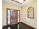 A marble-floored entryway shows the door and trim with wainscoting at 182 Southwind Ln, Greenwood, IN 46142