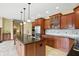 Bright kitchen featuring stainless appliances, granite countertops, and abundant cabinet storage at 182 Southwind Ln, Greenwood, IN 46142