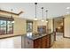 Large kitchen island boasts granite countertops, undermount sink, and custom wood trim at 182 Southwind Ln, Greenwood, IN 46142