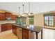 Open-concept kitchen with stainless appliances, island, and dining area for easy living at 182 Southwind Ln, Greenwood, IN 46142