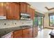 Stylish kitchen with a gas range, stainless appliances, granite counters, and modern tile at 182 Southwind Ln, Greenwood, IN 46142
