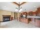 An expansive kitchen features an island, fireplace, and stainless steel appliances at 182 Southwind Ln, Greenwood, IN 46142