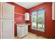 Laundry room featuring sink, cabinet and window at 182 Southwind Ln, Greenwood, IN 46142