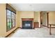Spacious living room featuring a fireplace, large windows and custom millwork at 182 Southwind Ln, Greenwood, IN 46142