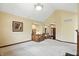 Spacious living room with a staircase, art on the walls, and a view of the front entry at 182 Southwind Ln, Greenwood, IN 46142