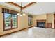 Bright living area features a fireplace, large windows, and custom wood trim at 182 Southwind Ln, Greenwood, IN 46142