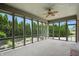 Sun room with large windows overlooking landscaped backyard at 182 Southwind Ln, Greenwood, IN 46142