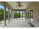 A sunroom with large windows and brick accents, offering a bright and airy space at 182 Southwind Ln, Greenwood, IN 46142