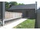 A backyard featuring a stone patio, wooden fence, and well-maintained lawn at 1905 N Alabama St, Indianapolis, IN 46202