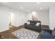 Finished basement with a large seating area, carpet, and bright, white walls at 1905 N Alabama St, Indianapolis, IN 46202