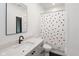 Clean and modern bathroom with a polka dot shower curtain and quartz countertops at 1905 N Alabama St, Indianapolis, IN 46202
