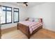 Bright bedroom with hardwood floors, large windows, and a comfortable bed at 1905 N Alabama St, Indianapolis, IN 46202