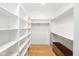 Bright walk-in closet with custom shelving and hardwood floors at 1905 N Alabama St, Indianapolis, IN 46202