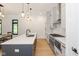 Bright kitchen featuring modern appliances, a spacious island, and plenty of cabinet space at 1905 N Alabama St, Indianapolis, IN 46202