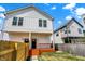 Charming two-story home with a wooden deck and well-maintained lawn at 2015 Yandes St, Indianapolis, IN 46202