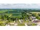 Aerial view of the property located in a charming neighborhood with a water tower and farmland nearby at 206 W Wall St, Advance, IN 46102
