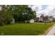 Large mature trees adorn this property featuring a single Gathering home and oversized detached garage at 206 W Wall St, Advance, IN 46102