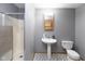 Bathroom featuring a shower, sink, and toilet at 206 W Wall St, Advance, IN 46102