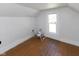 Bedroom features hardwood floors and natural light from the window at 206 W Wall St, Advance, IN 46102