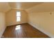 Bedroom features hardwood floors and natural light from the window at 206 W Wall St, Advance, IN 46102