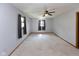 Bright bedroom with a ceiling fan and neutral carpet flooring at 206 W Wall St, Advance, IN 46102