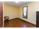 Cozy bedroom with hardwood floors, a window, and classic trim at 206 W Wall St, Advance, IN 46102