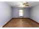 Cozy bedroom with hardwood floors, ceiling fan, and natural light at 206 W Wall St, Advance, IN 46102