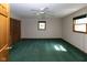Bright bedroom features a ceiling fan, natural light, and ample closet space at 206 W Wall St, Advance, IN 46102