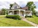 Charming two-story home with a welcoming front porch and manicured lawn at 206 W Wall St, Advance, IN 46102