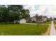 Charming vintage home featuring a welcoming front porch, a well-manicured lawn, and a detached two-car garage at 206 W Wall St, Advance, IN 46102