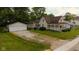 Charming vintage home featuring a welcoming front porch, a well-manicured lawn, and a detached two-car garage at 206 W Wall St, Advance, IN 46102