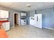 Spacious kitchen featuring white appliances, cabinets, and neutral flooring at 206 W Wall St, Advance, IN 46102