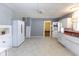 Spacious kitchen featuring white appliances, cabinets, and neutral flooring at 206 W Wall St, Advance, IN 46102