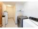 Laundry room featuring a washer, dryer, and water heater at 206 W Wall St, Advance, IN 46102