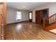 Bright living room featuring hardwood floors, natural light, and classic wood trim at 206 W Wall St, Advance, IN 46102