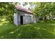 Outbuilding has grass all around it at 206 W Wall St, Advance, IN 46102