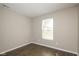 Well-lit bedroom with a view from the window, complemented by wood-look flooring at 2080 Bridlewood Dr, Franklin, IN 46131