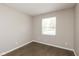 Cozy bedroom showcasing a window offering natural light and modern wood-look flooring at 2080 Bridlewood Dr, Franklin, IN 46131