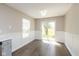 Dining area with wood-look floors and sliding glass doors to the backyard at 2080 Bridlewood Dr, Franklin, IN 46131